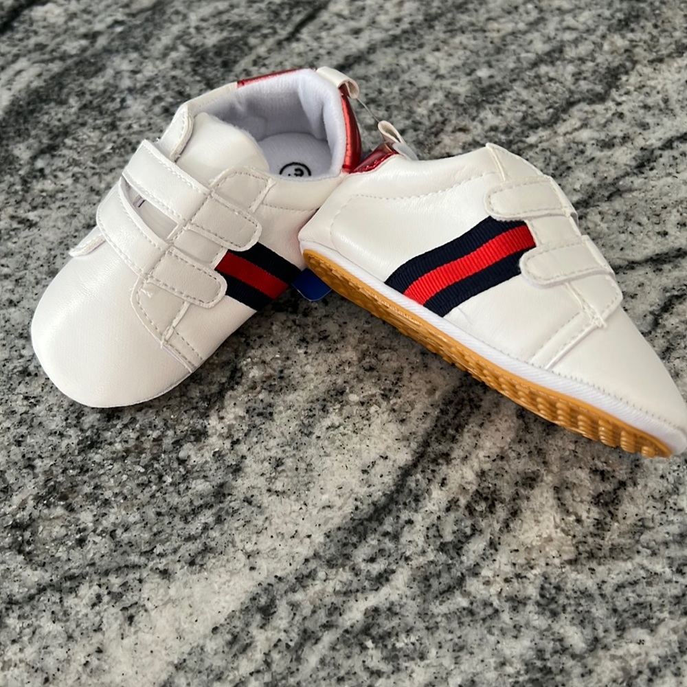 Unisex new baby designer like sneakers. Looks like your favorite designer!